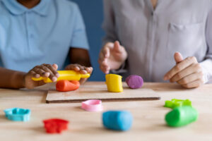 Child with Autism working with an occupational therapist