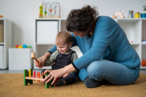 Autistic child playing with an occupational therapist