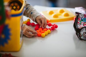 Child playing with sensory toys