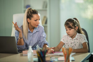 Teacher working individually with a student with ADHD