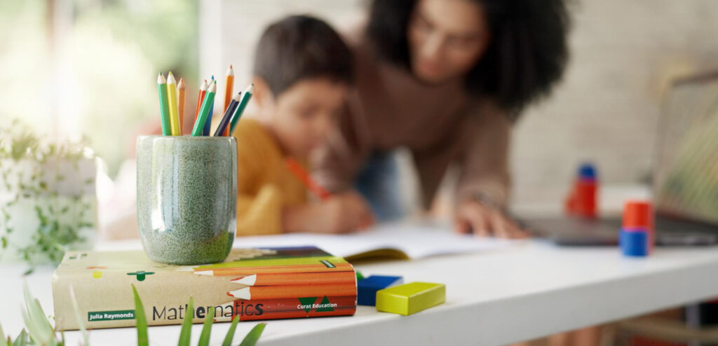 Teacher helping student struggling with ADHD in the classroom