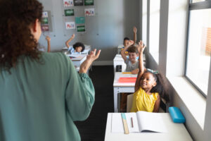 Teacher working with a classroom full of students